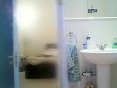 Tattooed babe spied in the shower