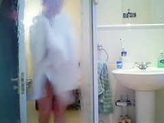 Tattooed babe spied in the shower