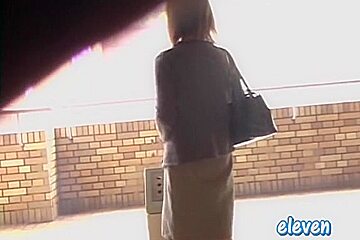 This hot Asian got skirt sharked while smoking a cigarette