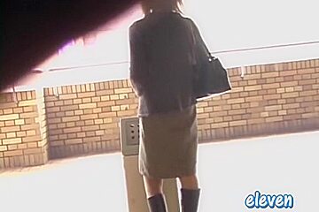 This hot Asian got skirt sharked while smoking a cigarette