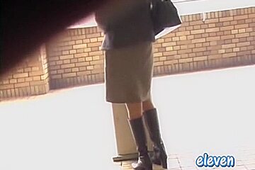 This hot Asian got skirt sharked while smoking a cigarette