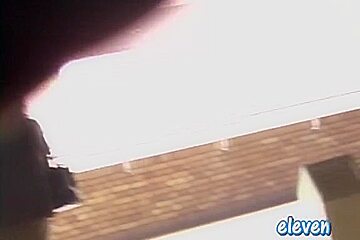 This hot Asian got skirt sharked while smoking a cigarette