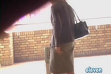 This hot Asian got skirt sharked while smoking a cigarette